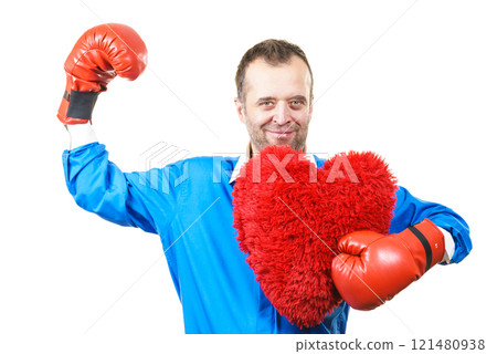 Man with boxing gloves holding heart 121480938