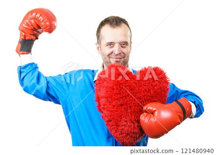 Man with boxing gloves holding heart Man with boxing gloves holding heart 121480940