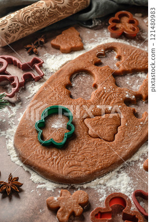 Christmas baking. Cutting out cookies from the dough. Ingredients for baking gingerbread. Festive xmas background Christmas baking. Cutting out cookies from the dough. Ingredients for baking gingerbread. Festive xmas background 121480983