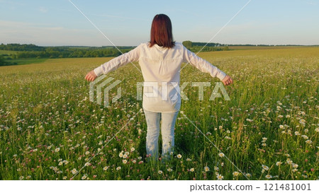 Beautiful Woman Enjoying Sunny Summer In Park Outdoors. Portrait Of A Beautiful Young Woman In Evening Against Background Of Sunset Sun. Enjoys An Evening Sunset. Gimbal Stabilize. 121481001