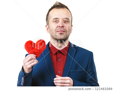 Man in suit holding heart Man in suit holding heart 121481089