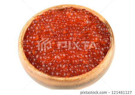 Close-up of a wooden bowl full of red caviar. Close-up of a wooden bowl full of red caviar. 121481127