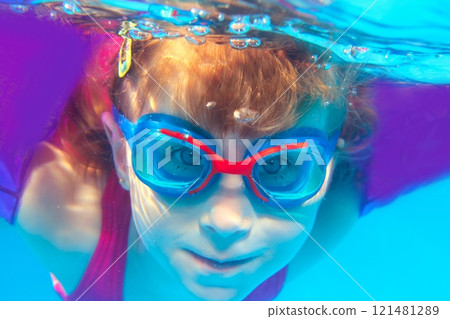 Underwater swimming girl goggles blue water Underwater swimming girl goggles blue water 121481289