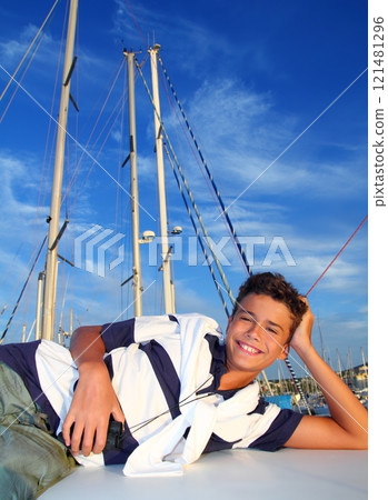 boy teenager vacation laying marina boat smiling boy teenager vacation laying marina boat smiling 121481296
