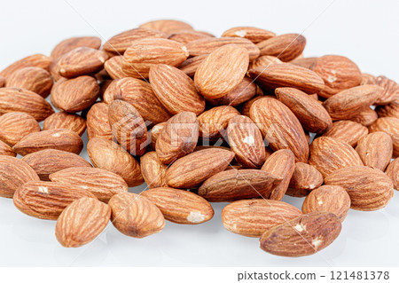 macro almond nuts on a white background 121481378