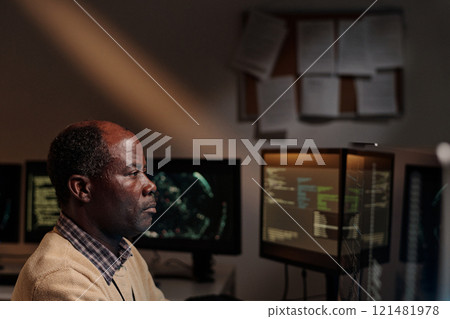 Man decoding online data on screen 121481978