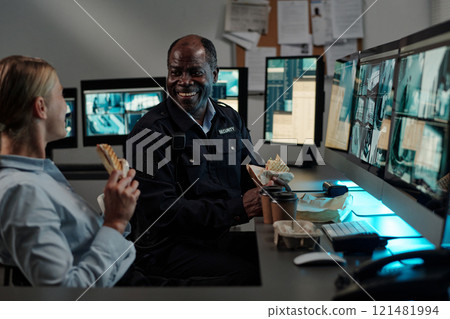 Happy guards chatting at lunch break Happy guards chatting at lunch break 121481994