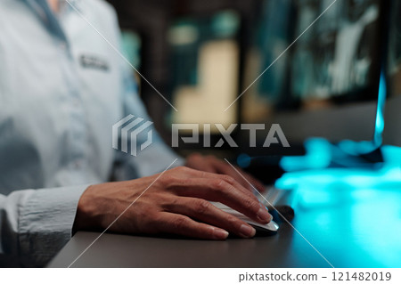 Hand of security guard on computer mouse 121482019