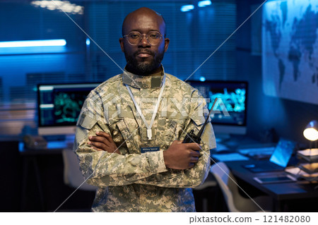 Serious officer in camouflage uniform Serious officer in camouflage uniform 121482080