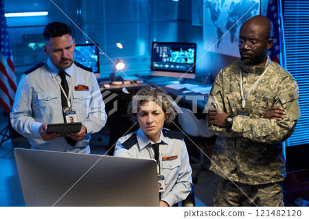 Colleagues looking at computer screen Colleagues looking at computer screen 121482120
