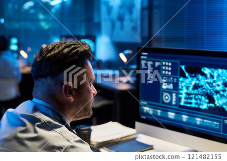 Officer looking at computer screen 121482155