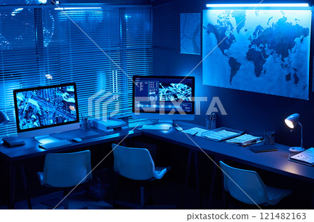 Desks with computer monitors in office 121482163
