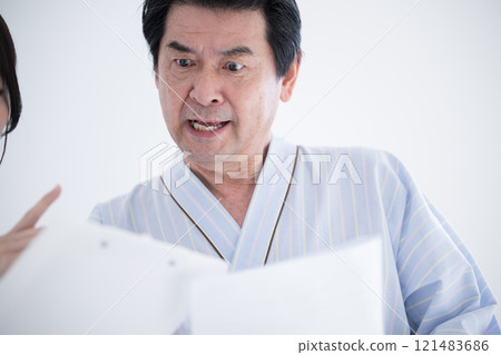 Close-up of a patient receiving health guidance from a nurse after a medical checkup 121483686