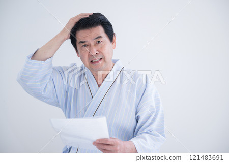 Close-up of a patient receiving health guidance from a nurse based on the results of a health check, looking at the camera Close-up of a patient receiving health guidance from a nurse based on the results of a health check, looking at the camera 121483691
