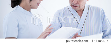 Patient receiving health guidance from a nurse based on the results of a health checkup Banner without a face 121483693