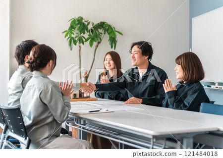 Businessmen in work clothes shaking hands during a business meeting (contract, partner, success) Businessmen in work clothes shaking hands during a business meeting (contract, partner, success) 121484018