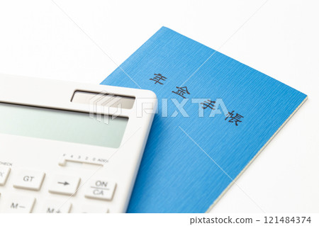 Calculator and pension book on white background Calculator and pension book on white background 121484374