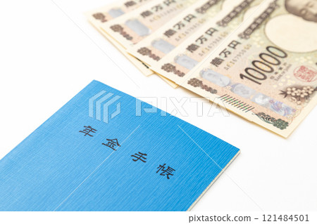 Pension book and money on white background 121484501