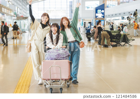 Image of girls excited before leaving on a trip Image of girls excited before leaving on a trip 121484586
