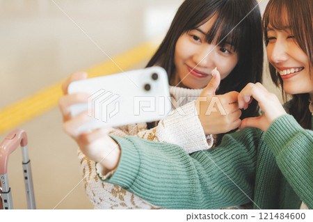 Image of girls excited before leaving on a trip Image of girls excited before leaving on a trip 121484600