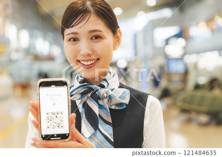 Image of a cabin attendant giving directions via smartphone 121484635
