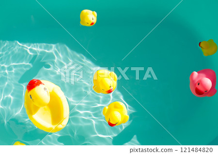 Rubber ducks in blue water Rubber ducks in blue water 121484820