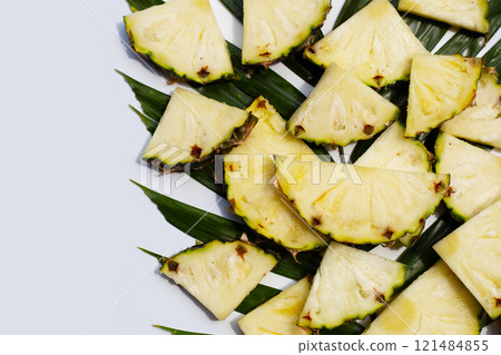 Fresh pineapple on green leaves Fresh pineapple on green leaves 121484855