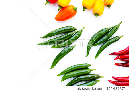 Chili peppers on a white background. Chili peppers on a white background. 121484871