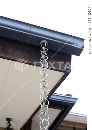 Japanese house rain gutter. Rain chains 121484904