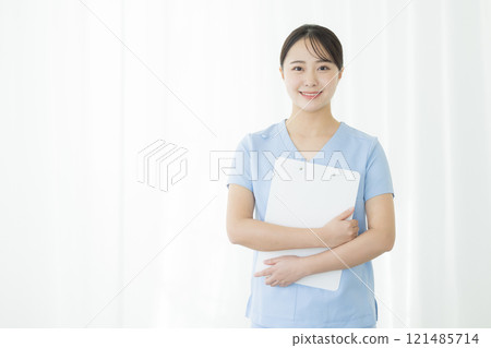 Nurse holding a medical record Nurse holding a medical record 121485714