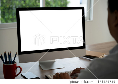 man working Businessman using a desktop computer of the blank screen with hands 121485745