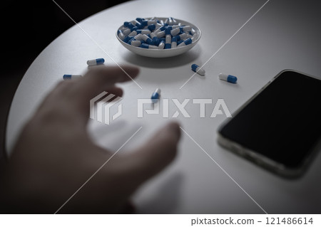 Overdose, OD image, hand injecting a large amount of medicine, drug overdose, stress, depression, young people, social problem 121486614