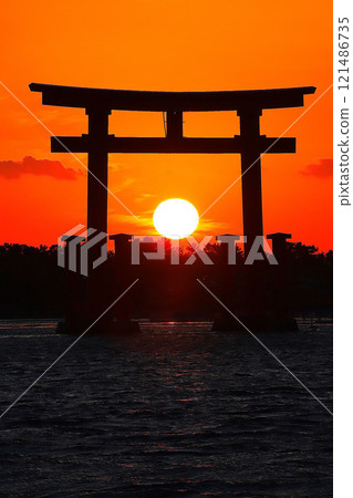 Hamamatsu: Red torii gate and sunset on Benten Island 121486735
