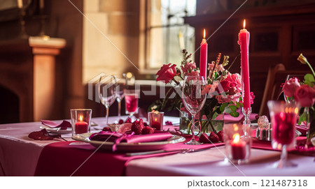 Festive table setting with candles and arrangement of beautiful red flowers. Holiday concept. High quality photo 121487318