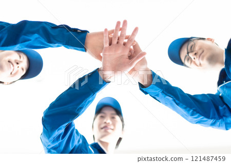 Logistic employees who are united by teamwork Logistic employees who are united by teamwork 121487459