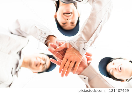A team of engineers dressed in work clothes A team of engineers dressed in work clothes 121487469