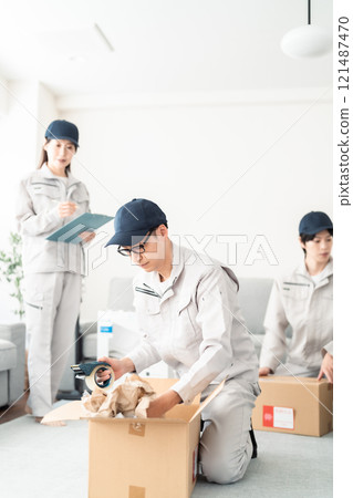 Staff packing for moving Staff packing for moving 121487470