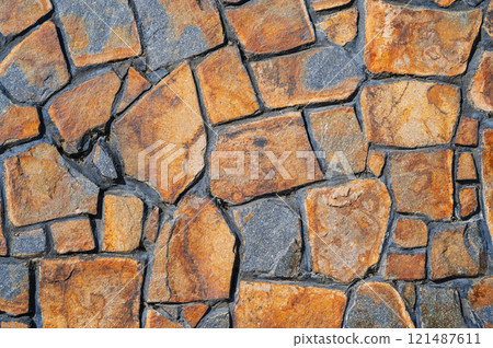 Wall made of old stones. Abstract background and texture for design. 121487611