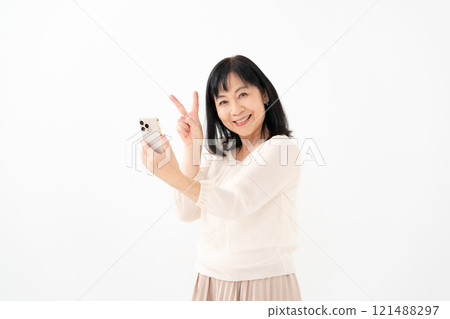Woman Senior Smartphone Peace Sign Woman Senior Smartphone Peace Sign 121488297
