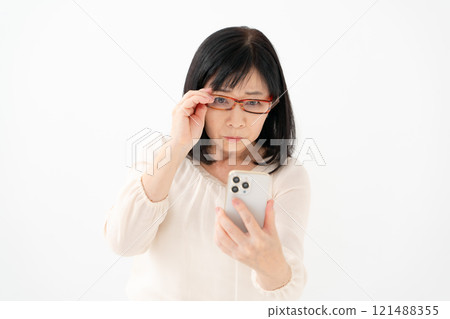 Female senior smartphone presbyopia Female senior smartphone presbyopia 121488355