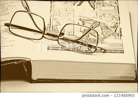 Glasses and a book 121488903