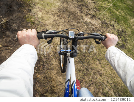 Woman on a bicycle Woman on a bicycle 121489011