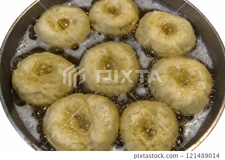 Donuts in a frying pan Donuts in a frying pan 121489014