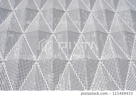 facade of modern building is covered with geometric metal aluminum panels facade of modern building is covered with geometric metal aluminum panels 121489433