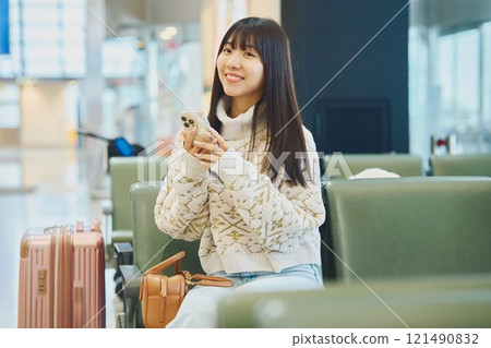A woman looking forward to going on a trip 121490832