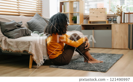 woman sit Depression Dark haired  pensive glance Standing by window and anxiety Copy space. 121490997