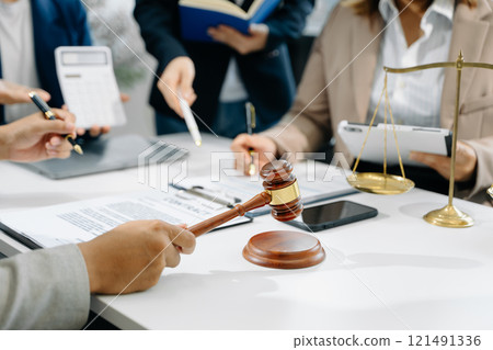 business people and lawyers discussing contract papers sitting at the table. Concepts of law, advice, legal services. 121491336