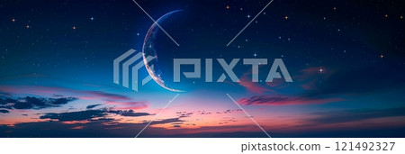 A crescent moon and stars to symbolize the beginning of the Islamic month of Dhu al-Hijjah. 121492327