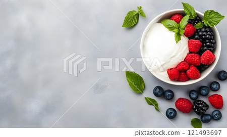 A fresh fruit bowl with a side of quark, styled for a summer brunch 121493697