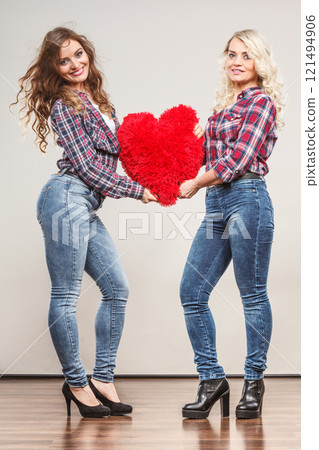 adult daughter and mother with heart love sign adult daughter and mother with heart love sign 121494906